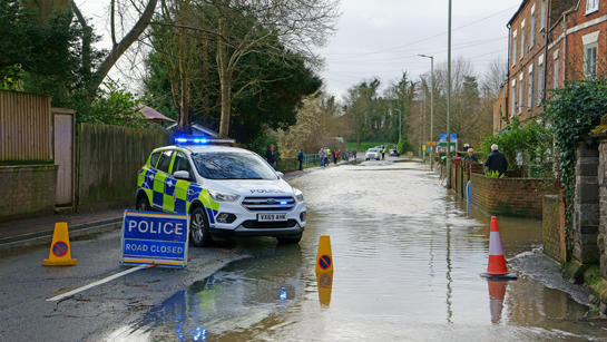 Flooded Road With Police Car